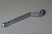 Metal wrench on a plain background