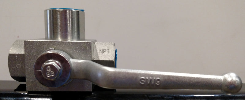 Metal valve with a handle on a gray background