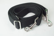 Black strap with clips on both ends. 