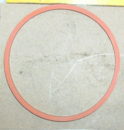 Red circular object on a beige background