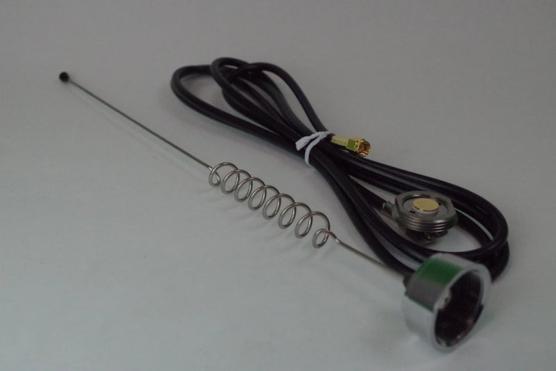 Electrical components including a spring, antenna, and wiring on a white background