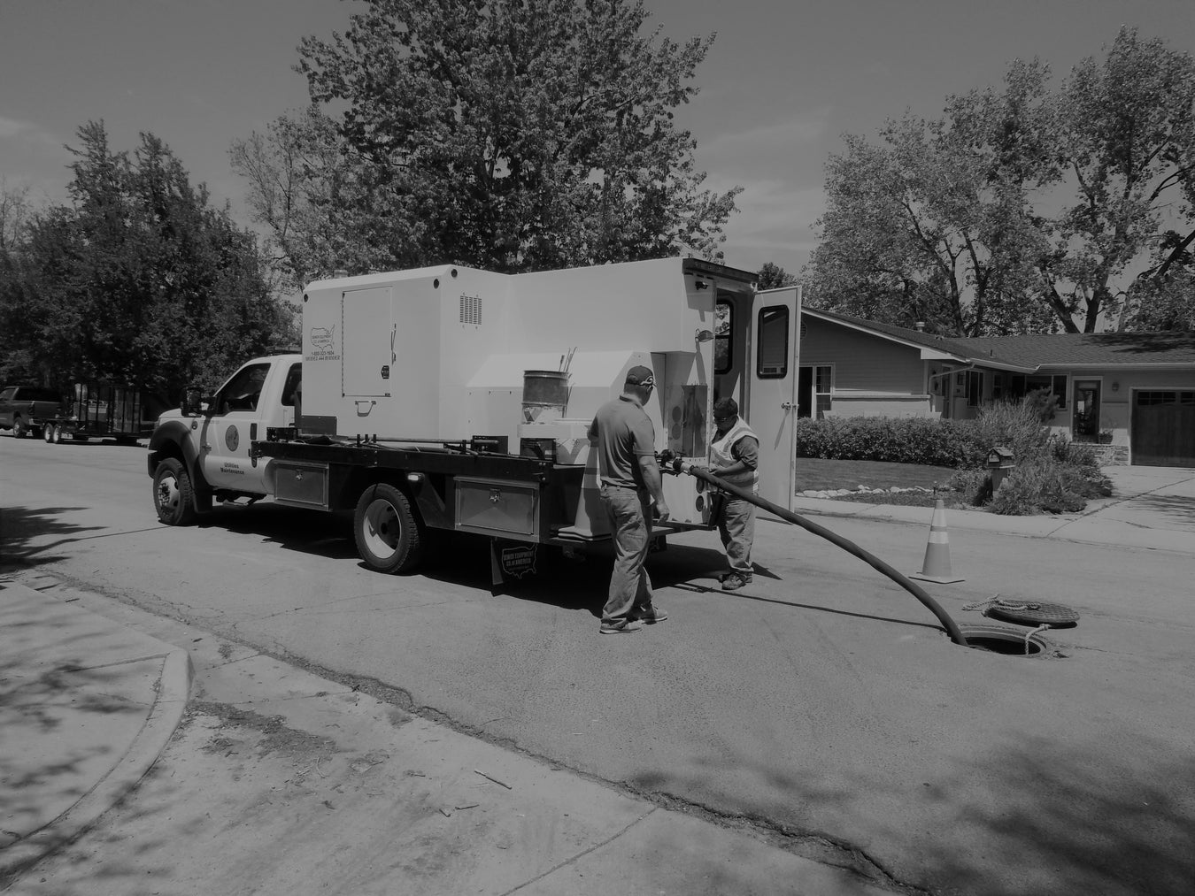 Rodder truck cleaning out sewer line