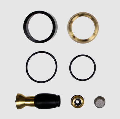 Set of black, gold, and silver plumbing parts on a white background